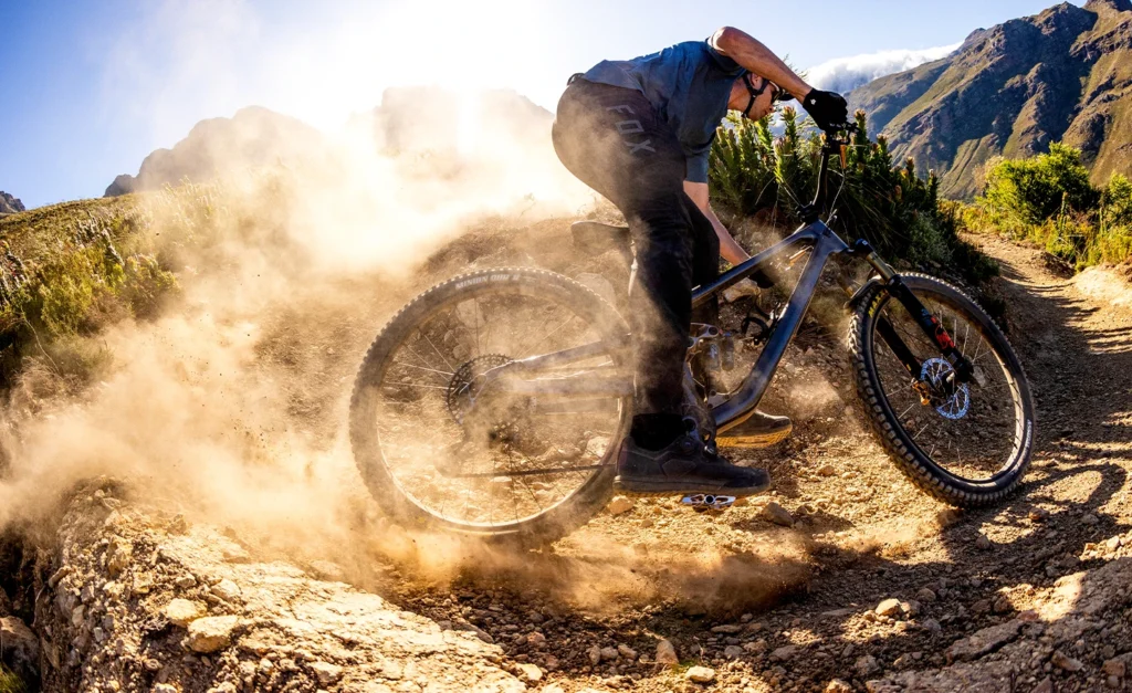 Norco mountain bike rider sliding through a dusty corner in Aspen Colorado